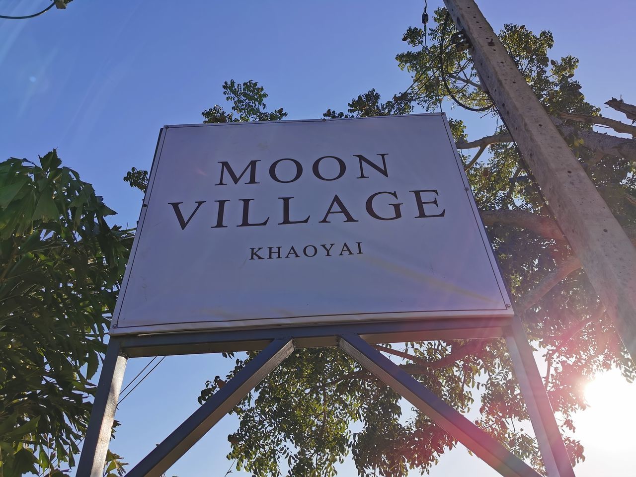 LOW ANGLE VIEW OF SIGN AGAINST SKY