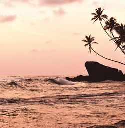 Scenic view of sea against sky at sunset