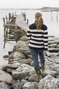 Woman walking on jetty