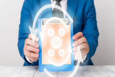 Close-up of man holding mobile phone