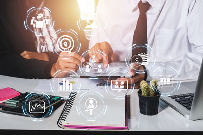 Midsection of man holding food on table