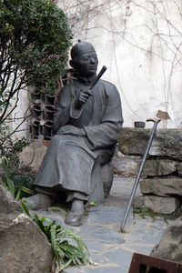 Statue against trees