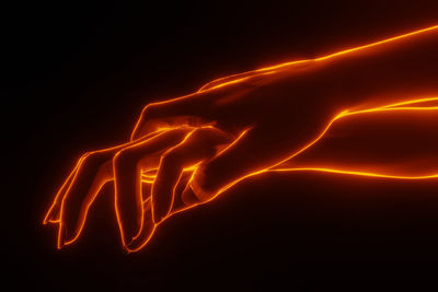 Close-up of illuminated light painting against black background
