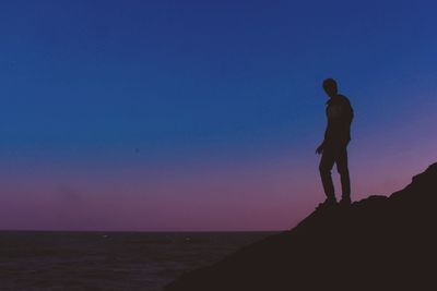 Silhouette of man at sunset