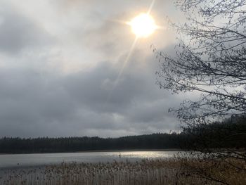 Scenic view of lake against sky during winter