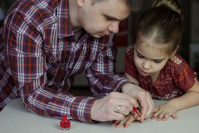 Close-up of boy playing with toy