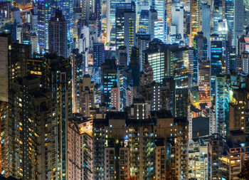 Aerial view of illuminated buildings in city at night