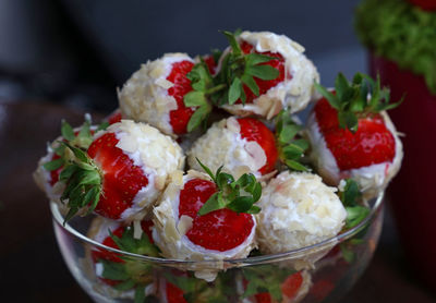 Chocolate covered strawberries in glass bowl on table