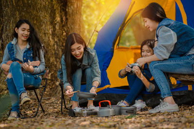 Two women sitting in traditional clothing