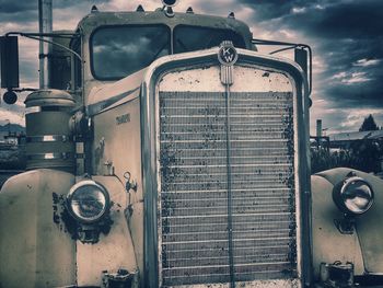 Train in old factory against sky