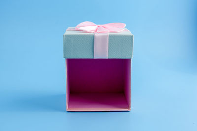 Close-up of gift box against blue background