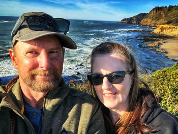 Portrait of smiling couple at beach