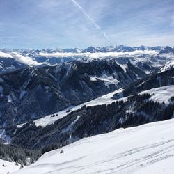 Scenic view of snow covered mountains against sky