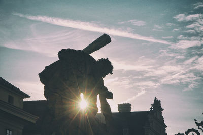 Low angle view of statue against sky during sunset