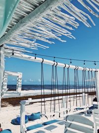 Scenic view of beach against clear blue sky