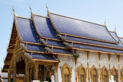 Low angle view of roof of building against clear sky