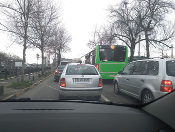 Cars on road against sky