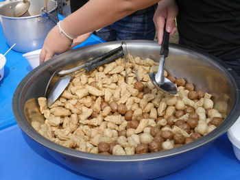 Close-up of person preparing food in bowl
