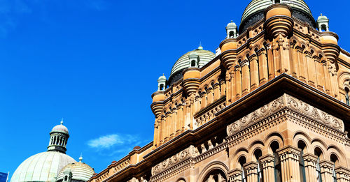 Low angle view of building against blue sky