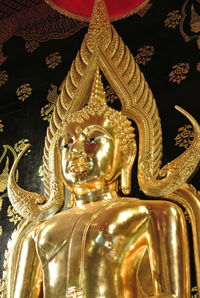 Close-up of buddha statue in temple