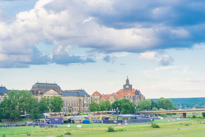 Scenic view of buildings and trees against sky