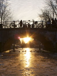 Sun shining over river