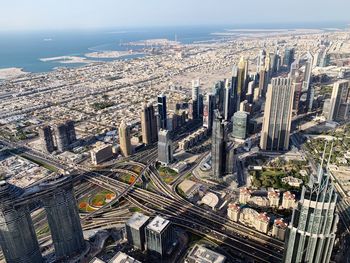 High angle view of modern buildings in city against sky