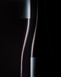 Close-up of beer bottle against black background