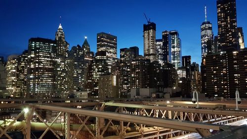 Illuminated modern buildings in city at night