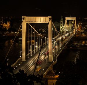 High angle view of bridge over river at night