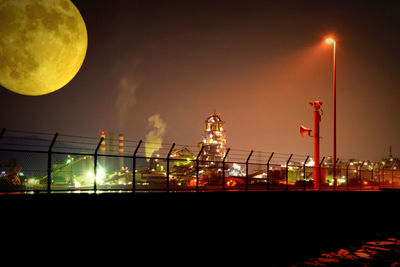 Low angle view of illuminated street light at night