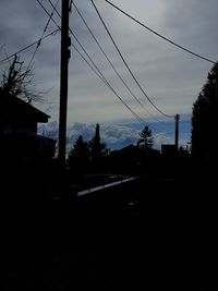 Low angle view of electricity pylon against sky