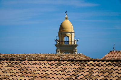 View of old building against blue sky