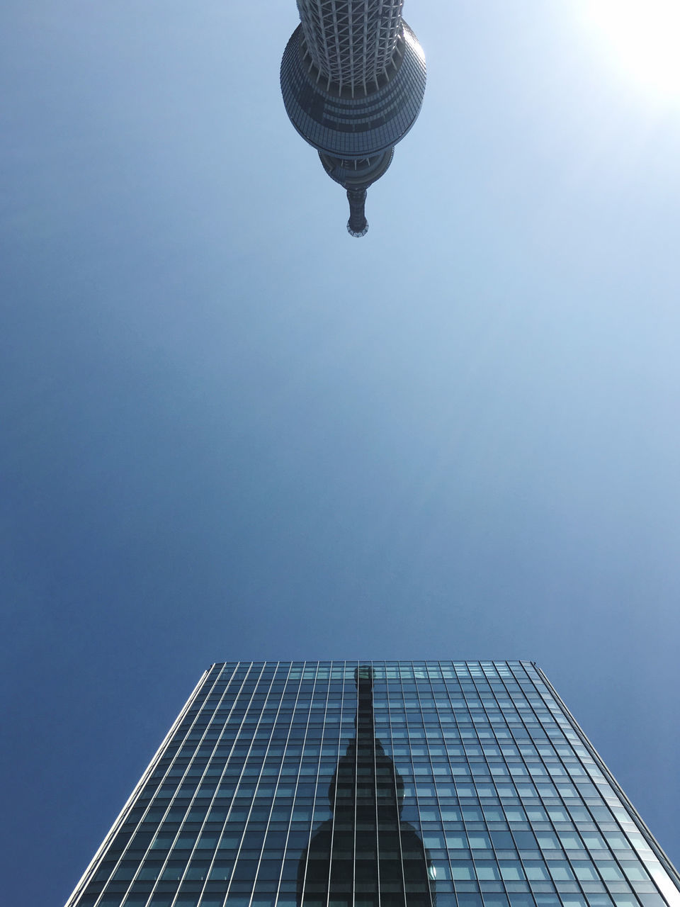 architecture, built structure, sky, skyscraper, building exterior, city, nature, office building exterior, building, blue, low angle view, no people, outdoors, day, technology, tower, clear sky, sunlight, lighting, light, solar power