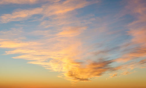 Low angle view of dramatic sky during sunset