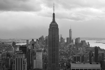 Empire state building and towers in city