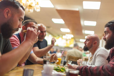 Group of people sitting on table