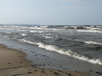 Scenic view of beach against clear sky