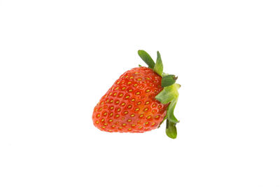 Close-up of strawberry over white background