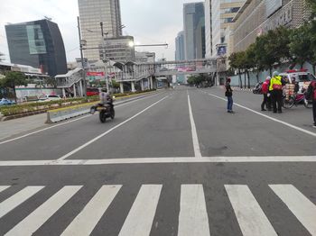 People crossing road in city