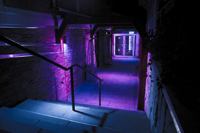 High angle view of illuminated steps in abandoned building