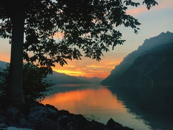 Scenic view of lake against sky during sunset