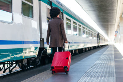 Elegant woman going for business trip on train