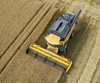 High angle view of combine harvester on wheat farm