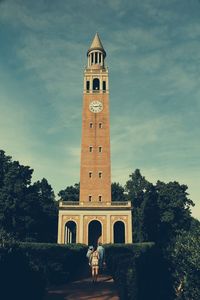 People in front of built structure
