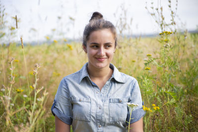 Portrait of smiling woman on field