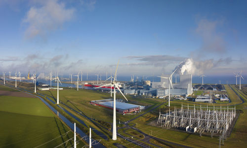 Netherlands, groningen province, eemshaven, aerial view of solar station, wind farm and gas-fired power station
