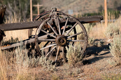 Close-up of abandoned wheel in field