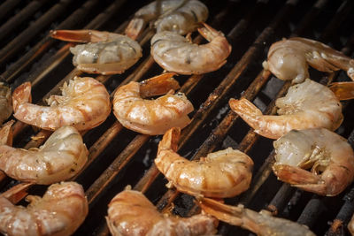 High angle view of meat on barbecue grill