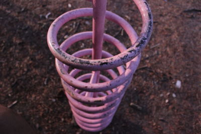 High angle view of rusty wheel on field